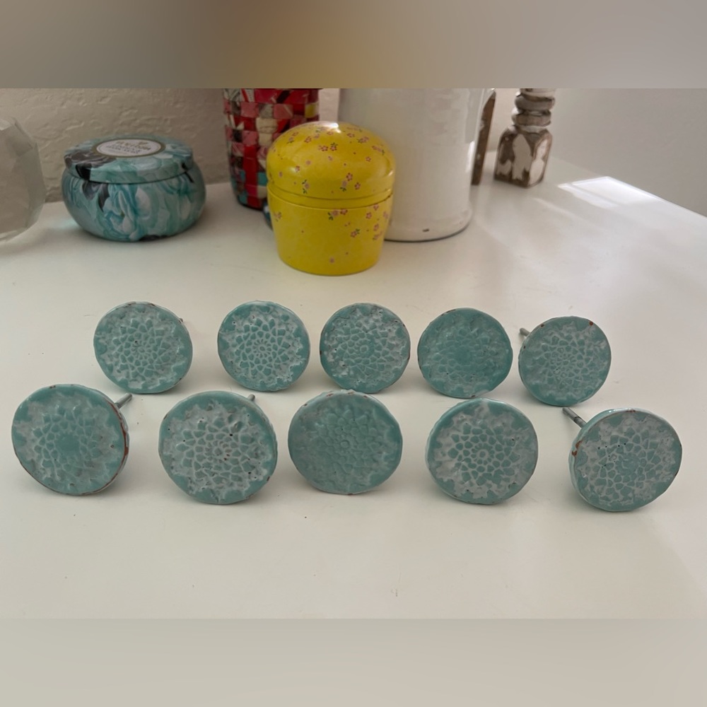 8 Turquoise ceramic Knobs from Anthropologie. Each is hand made & hand painted.